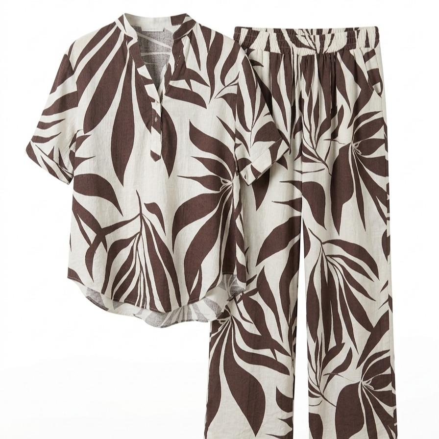 Conjunto de dos piezas fluido estampado de hojas tropicales con camisa de manga corta abotonada y pantalón largo de pernera amplia con cintura elástica