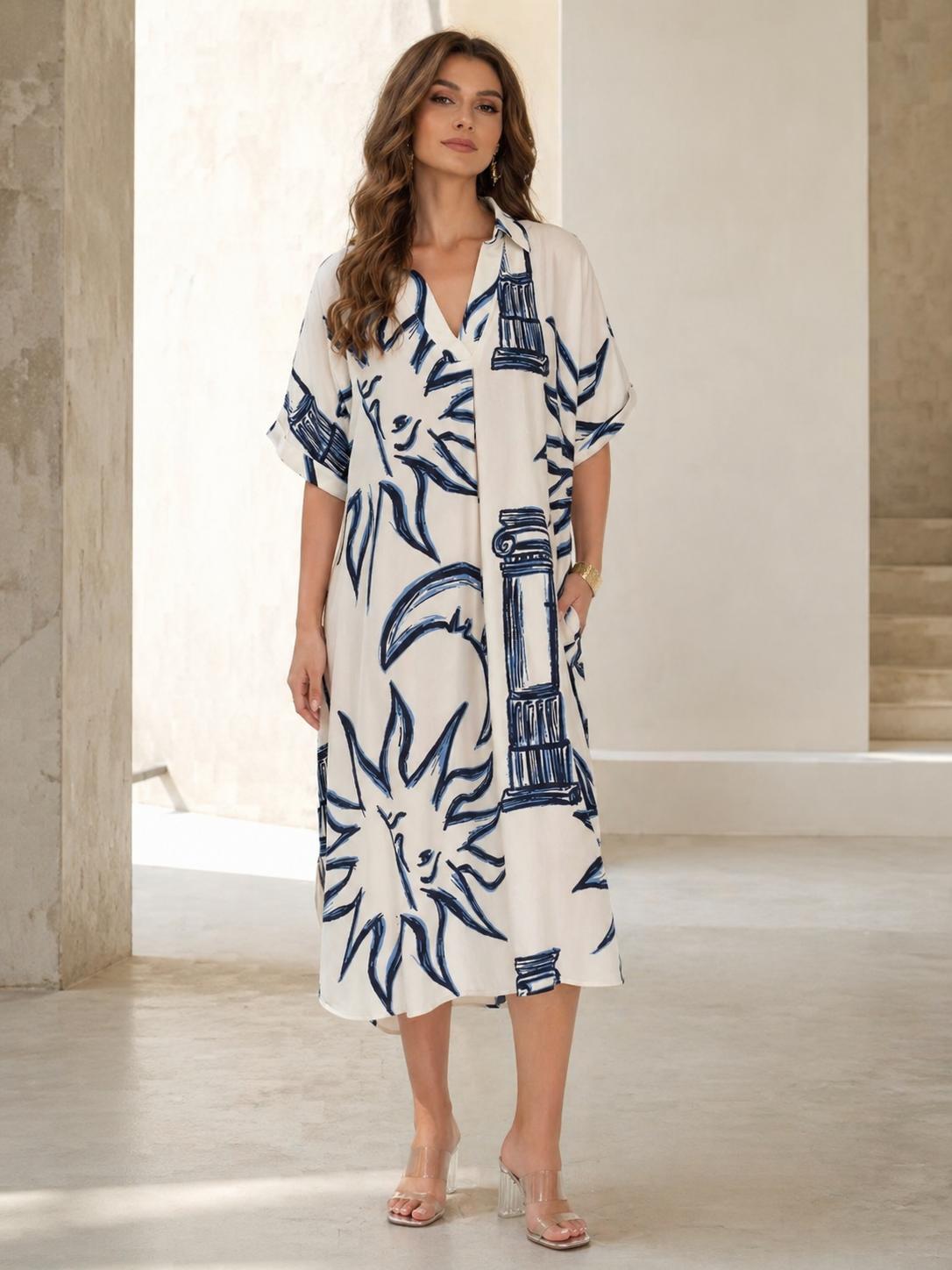 Vestido oversize estampado abstracto azul con cuello camisero y escote en V, manga corta amplia y bolsillos laterales, diseño fluido y elegante con tejido ligero y transpirable ideal para verano, look moderno y versátil perfecto para día a día
