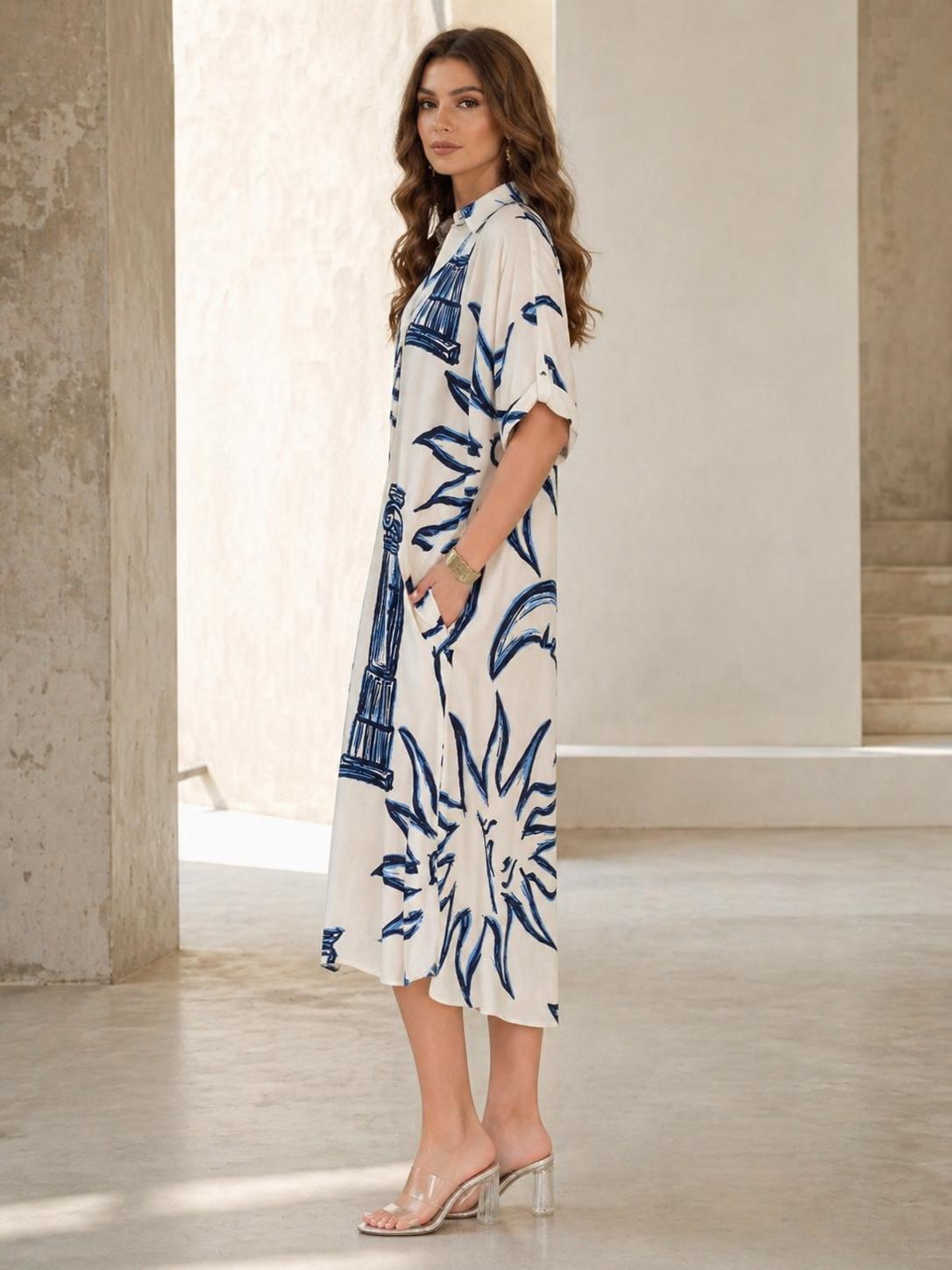 Vestido oversize estampado abstracto azul con cuello camisero y escote en V, manga corta amplia y bolsillos laterales, diseño fluido y elegante con tejido ligero y transpirable ideal para verano, look moderno y versátil perfecto para día a día